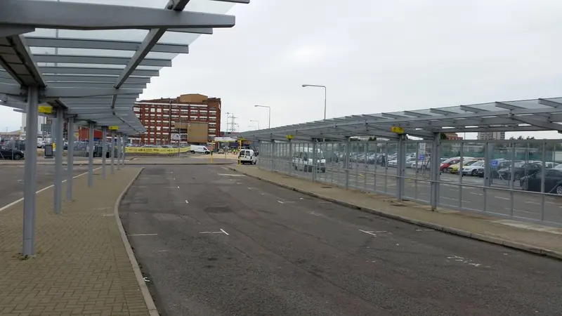 Covered drop-off and pick-up lanes beside a Southampton cruise terminal